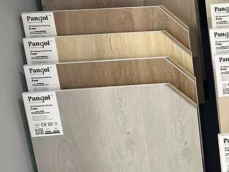 Pangol SPC waterproof flooring samples on display stands.